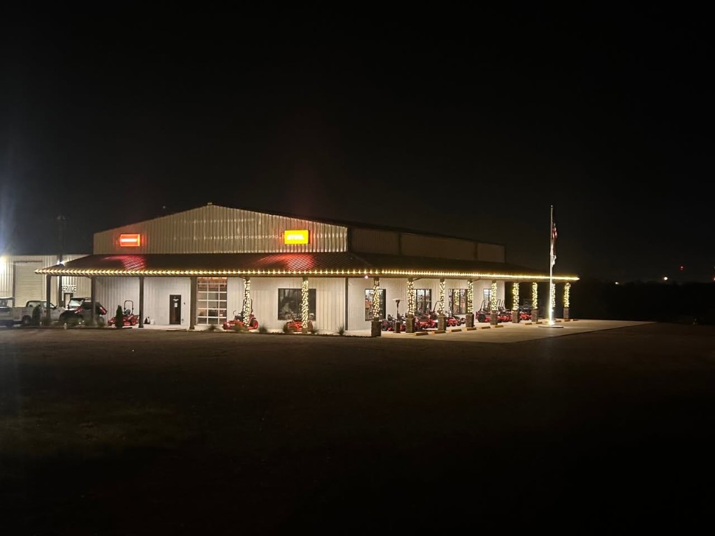 Commercial Christmas light installation with roofline lighting and wrapped columns