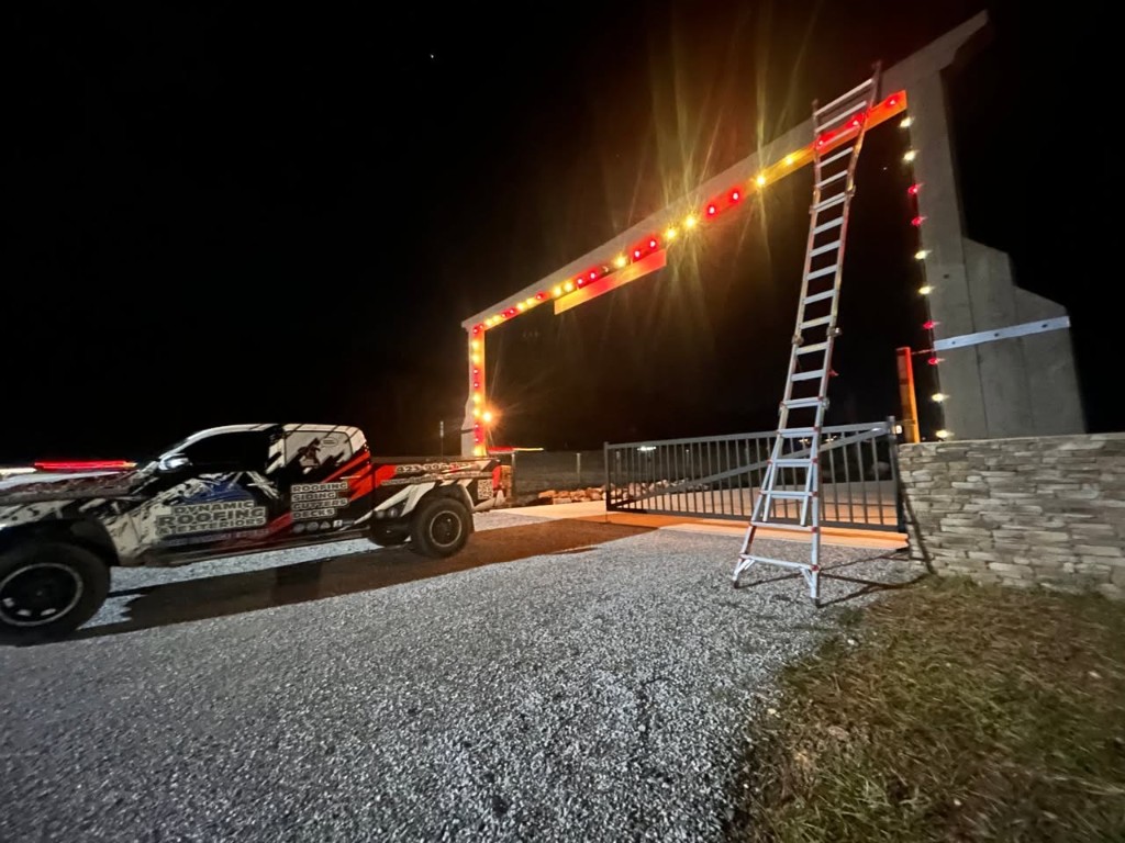 Christmas lights installed around commercial property entrance