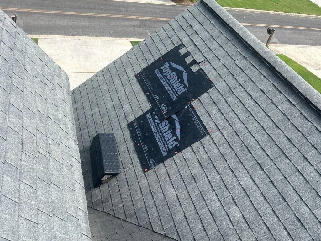 Temporary roof dry-in over damaged shingle areas