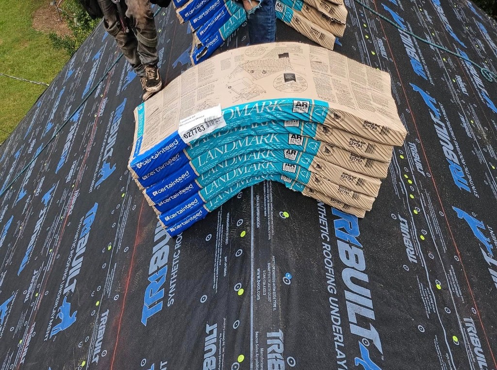 CertainTeed Landmark shingle bundles staged on synthetic underlayment