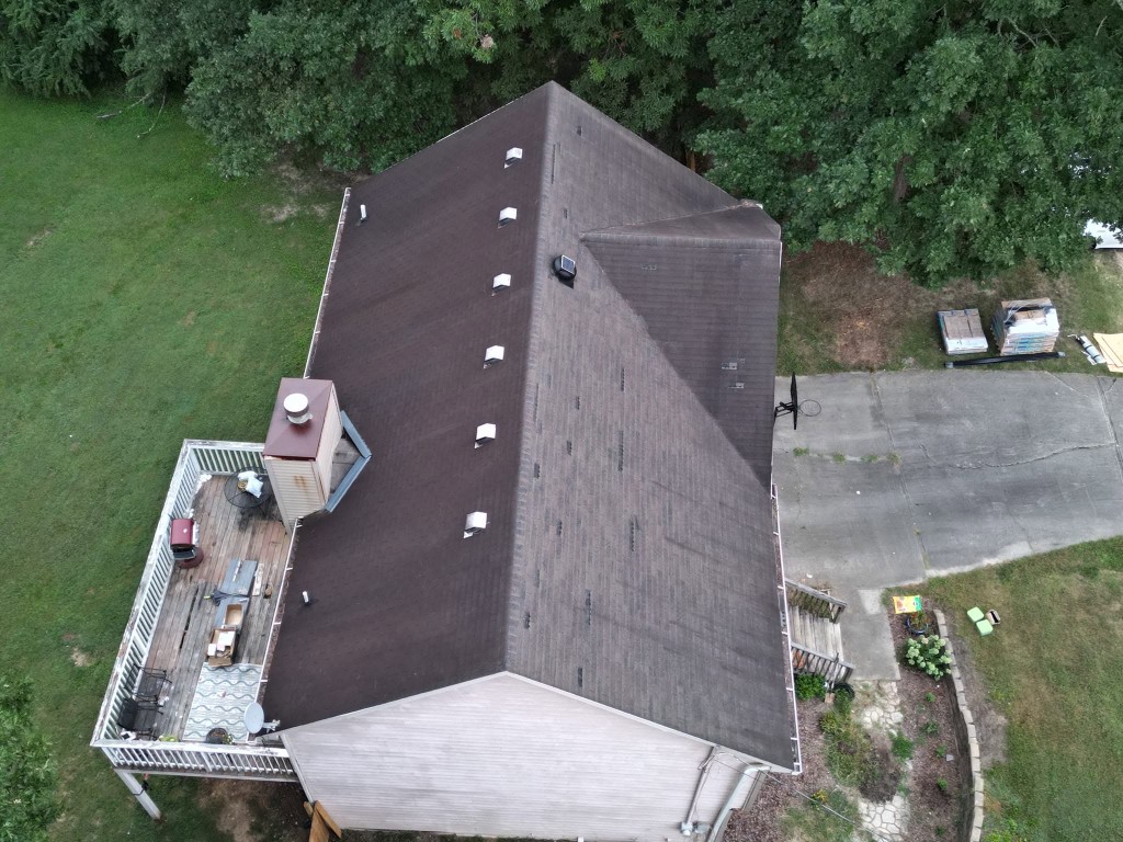 Second before aerial view of existing roof